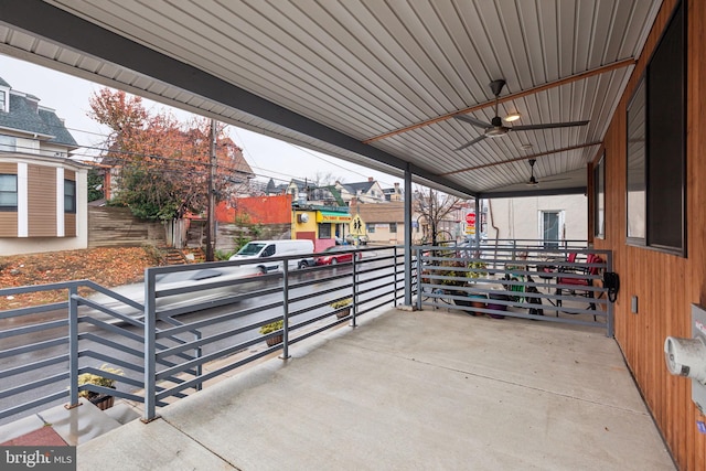 view of patio with ceiling fan and a porch