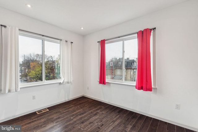 empty room featuring dark hardwood / wood-style floors