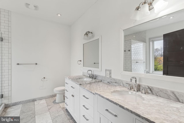 bathroom featuring toilet, an enclosed shower, and vanity