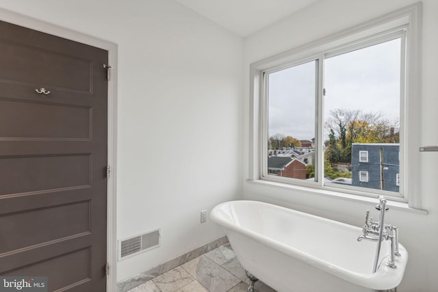 bathroom featuring a tub to relax in