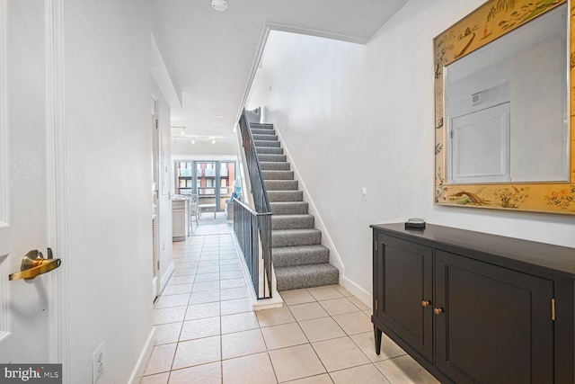 staircase with tile patterned flooring