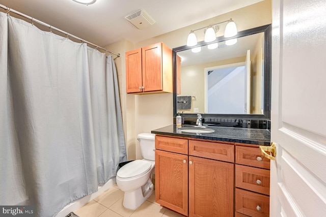 bathroom with vanity, curtained shower, tile patterned floors, and toilet