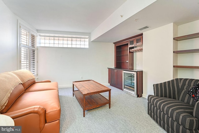 616 E NW Unit 1150, Washington, DC 20004 - living area with wine cooler, light carpet, a dry bar, and baseboards
