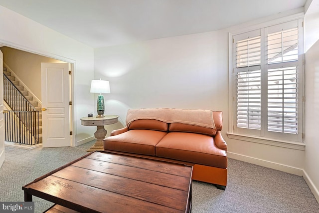 616 E NW Unit 1150, Washington, DC 20004 - carpeted living room with stairs, plenty of natural light, and baseboards