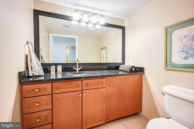 616 E NW Unit 1150, Washington, DC 20004 - bathroom with toilet, vanity, and tile patterned flooring