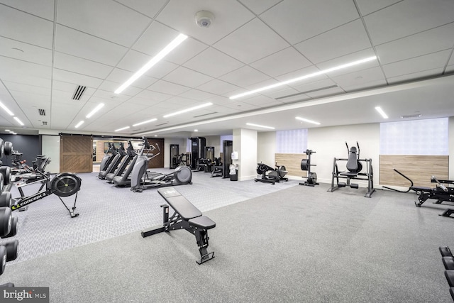 616 E NW Unit 1150, Washington, DC 20004 - gym with baseboards, a paneled ceiling, and carpet floors