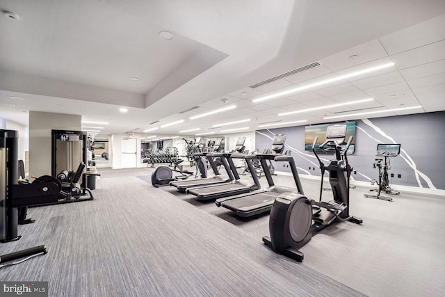 exercise room featuring carpet flooring