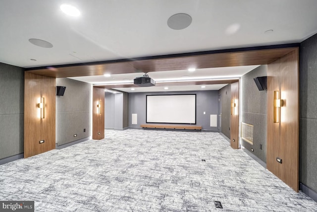 cinema featuring light colored carpet