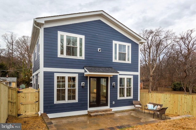 rear view of property with a patio area