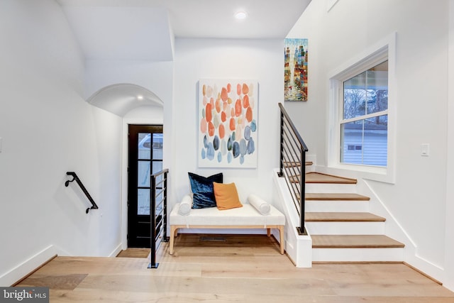 staircase featuring wood-type flooring