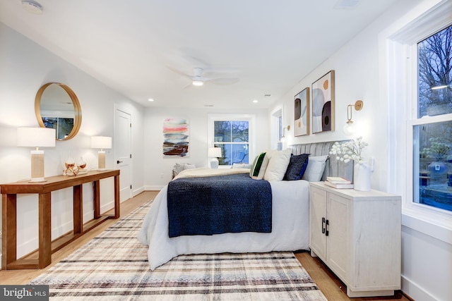 bedroom featuring ceiling fan and light hardwood / wood-style floors