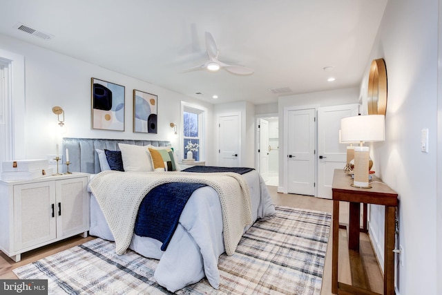 bedroom with ceiling fan and light wood-type flooring