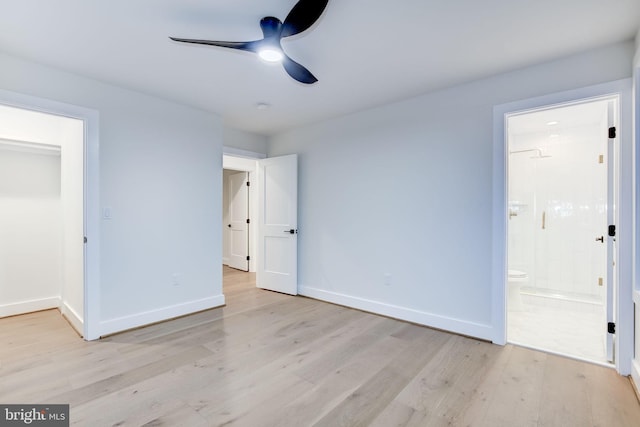 unfurnished bedroom with ceiling fan, connected bathroom, and light hardwood / wood-style floors