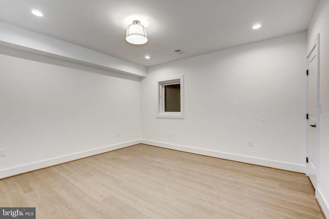 empty room with light hardwood / wood-style floors