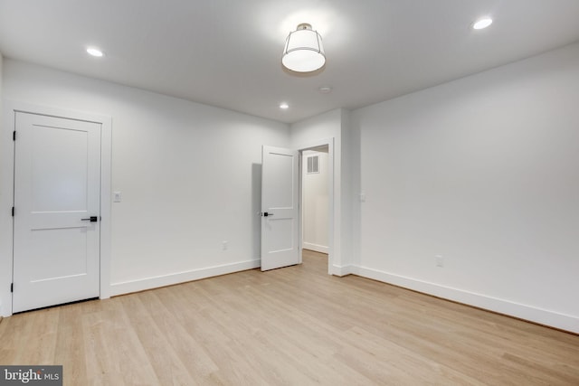 spare room with light wood-type flooring