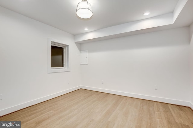 spare room with light hardwood / wood-style flooring