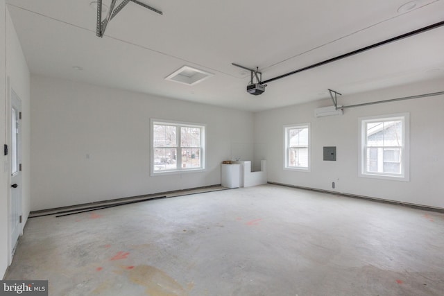 garage featuring a garage door opener and electric panel