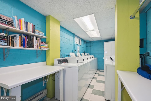 laundry area featuring washing machine and clothes dryer