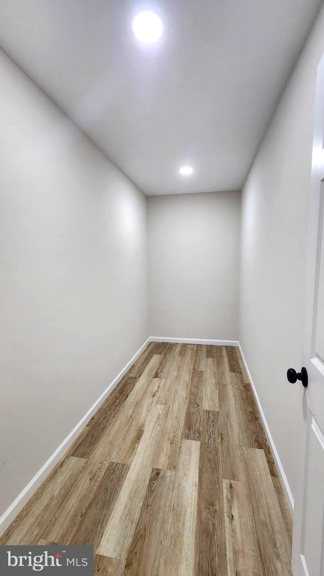 empty room with light hardwood / wood-style floors