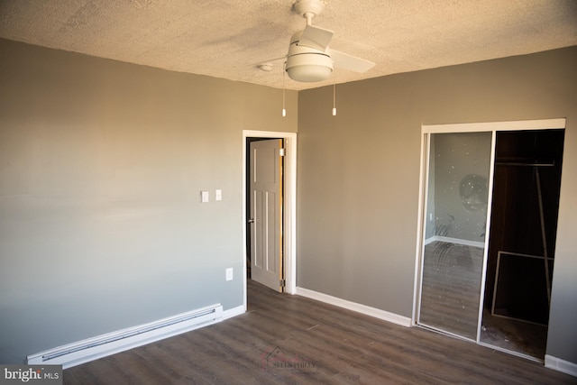 unfurnished bedroom with a textured ceiling, ceiling fan, dark wood-type flooring, a baseboard radiator, and a closet