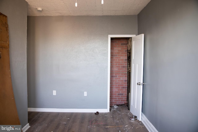 spare room with dark wood-type flooring