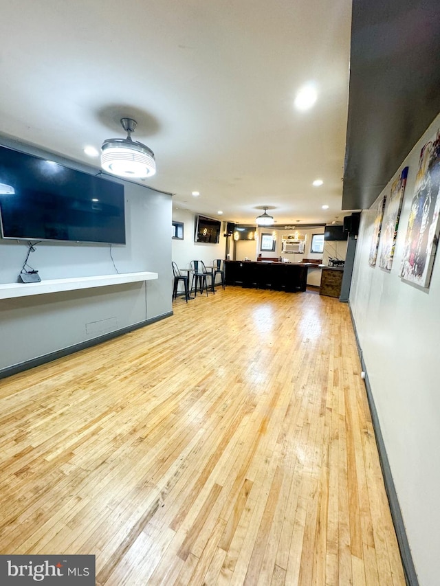 unfurnished living room with light wood-type flooring