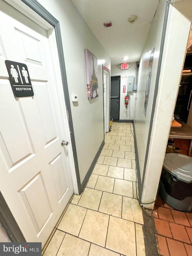 corridor featuring light tile patterned flooring