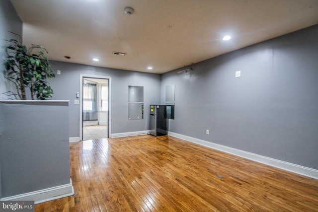 empty room with light hardwood / wood-style floors