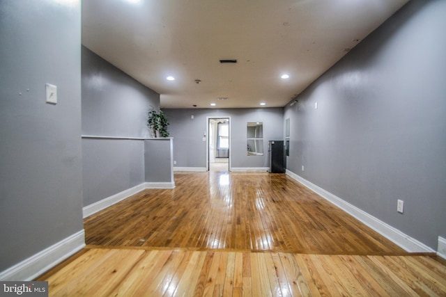 empty room with wood-type flooring