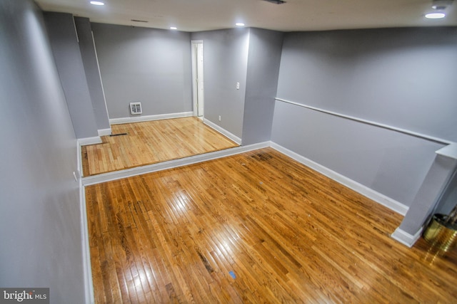 empty room featuring hardwood / wood-style flooring