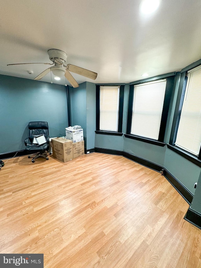 unfurnished room featuring ceiling fan and light hardwood / wood-style flooring