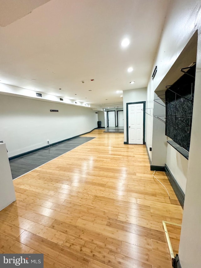 interior space featuring basketball court and light wood-type flooring