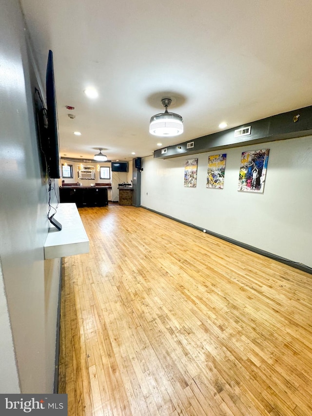 unfurnished living room with light wood-type flooring