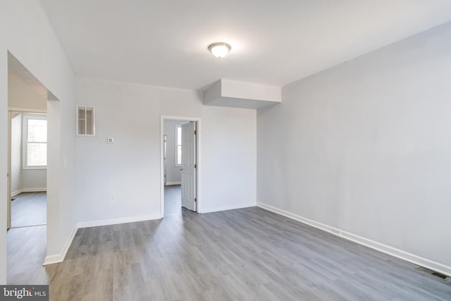 empty room with hardwood / wood-style floors