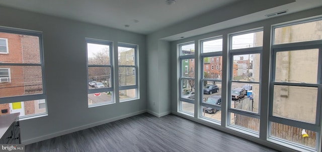 empty room featuring dark hardwood / wood-style floors