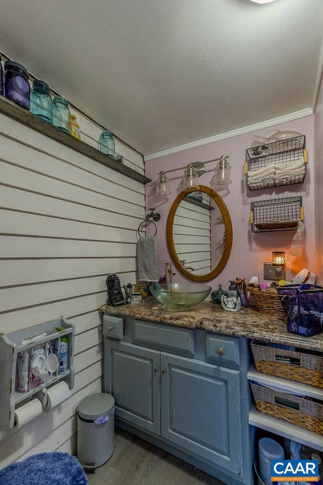 bathroom with vanity and crown molding