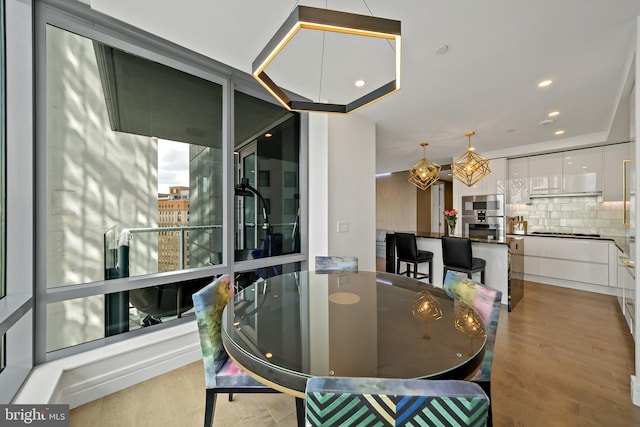 dining room with light wood-type flooring