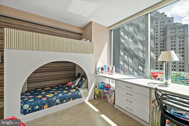 bedroom with light hardwood / wood-style flooring