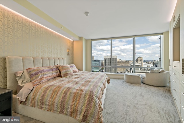 bedroom featuring floor to ceiling windows