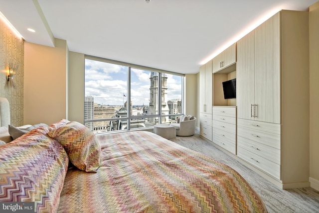 bedroom featuring a wall of windows