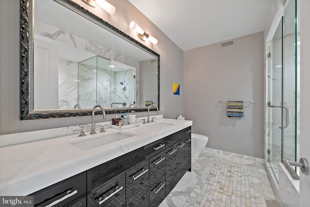 1414 S Penn Sq Unit 22B, Philadelphia, PA 19102 - full bathroom featuring double vanity, a marble finish shower, toilet, and marble finish flooring