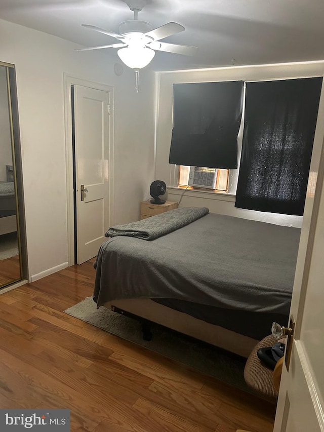 bedroom featuring hardwood / wood-style flooring and ceiling fan