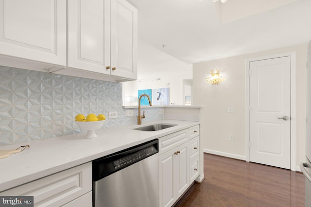 kitchen featuring tasteful backsplash, white cabinetry, sink, dark hardwood / wood-style flooring, and stainless steel dishwasher