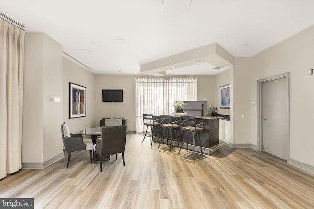 dining space featuring light hardwood / wood-style floors