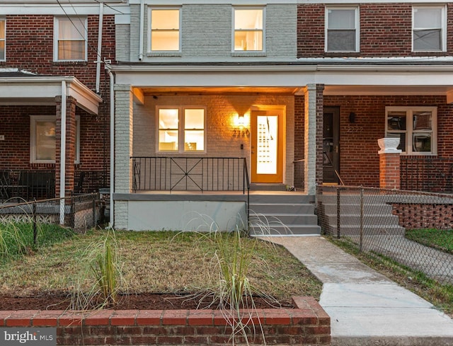 property entrance featuring covered porch