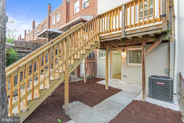 exterior space featuring a wooden deck and central AC unit