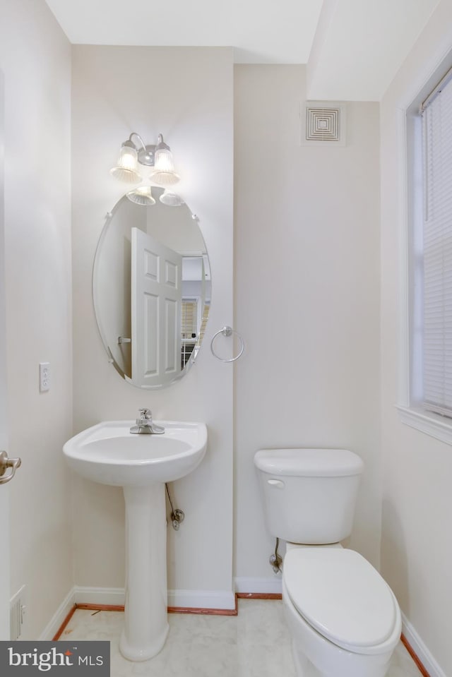 bathroom featuring toilet