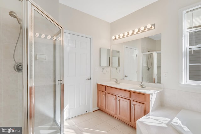 bathroom featuring tile patterned flooring, vanity, and a shower with door