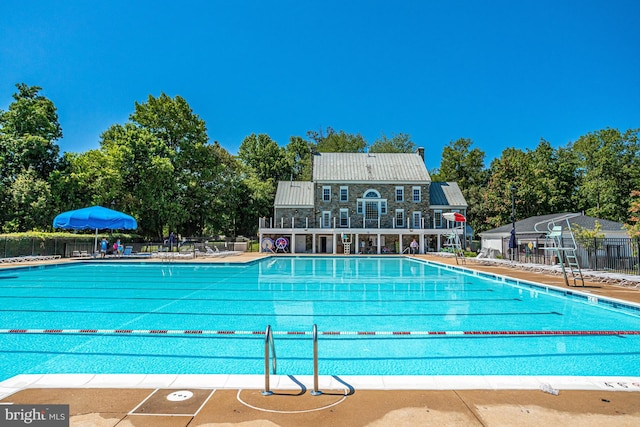 view of swimming pool with a patio