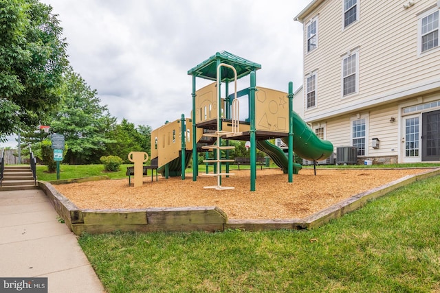 view of jungle gym featuring central AC unit and a lawn